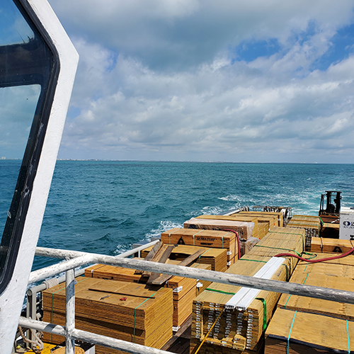 Lumber and building materials stacked on the back of a boat as a part of the hurricane recovery efforts after Hurricane Dorian.