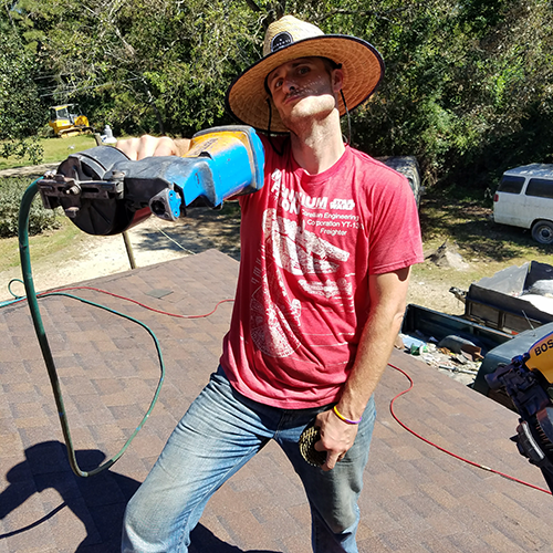 Man pretends to be "gangsta" with a nail gun while replacing a roof.