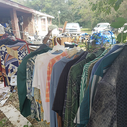 Clothing hung outside after home flooded.